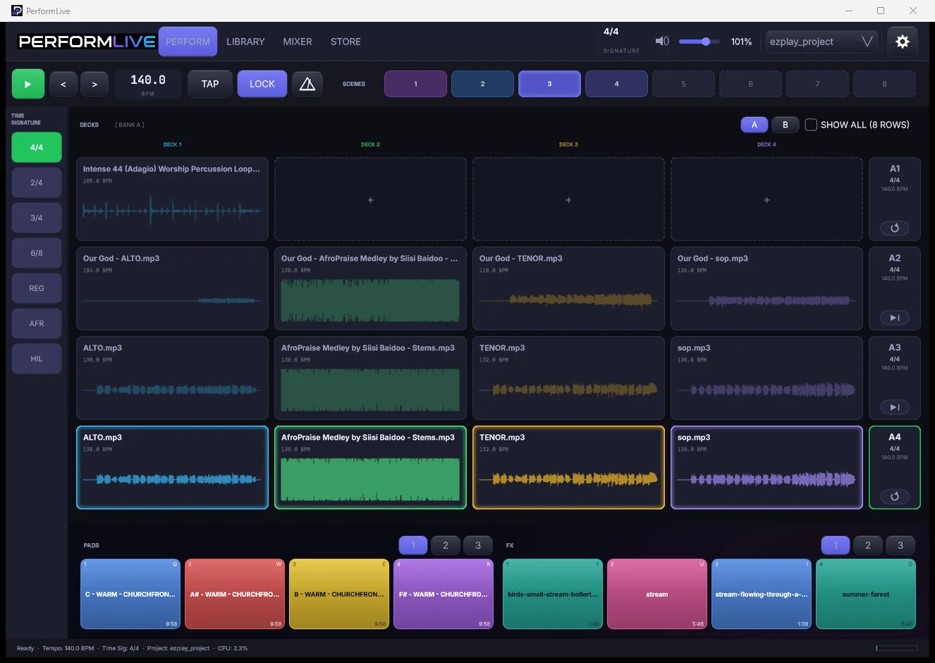 The PerformLive perform workspace: four decks of stems, scenes, transport, and twelve pads
